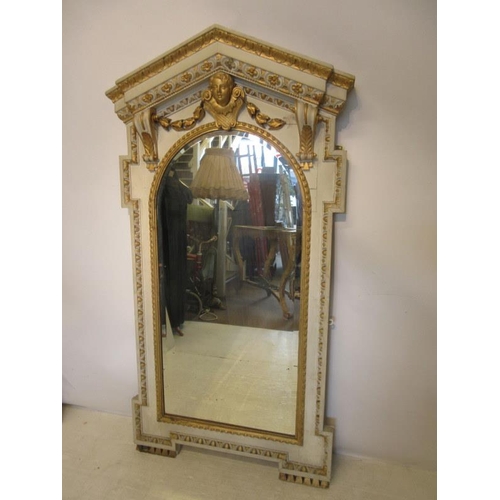 123 - A decorative antique carved wood painted and gilded wall mirror. H. 160cm, W. 82cm. approx.