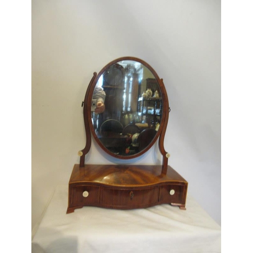 124 - Antique mahogany serpentine shaped dressing mirror having rosewood banding and fitted with three dra... 