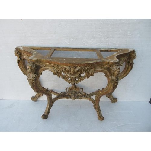 126 - A fine antique serpentine shaped console table decorated with carved heads and raised on cabriole le... 