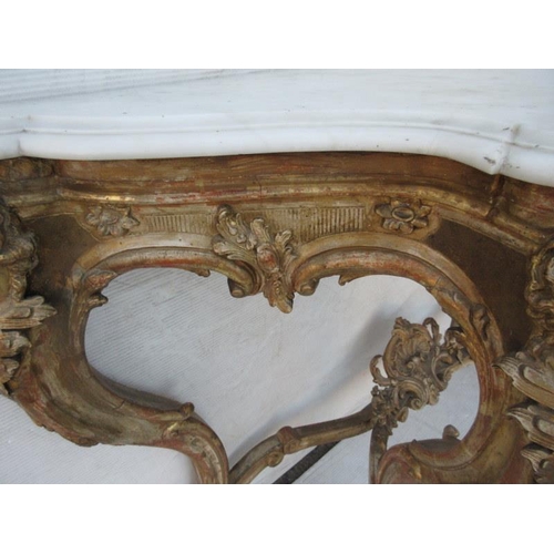 126 - A fine antique serpentine shaped console table decorated with carved heads and raised on cabriole le... 