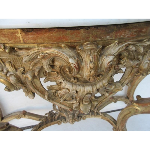 126 - A fine antique serpentine shaped console table decorated with carved heads and raised on cabriole le... 