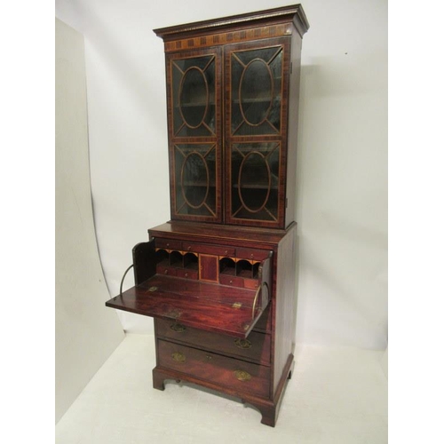 133 - A fine Irish Georgian mahogany secretaire bookcase, the upper section having inlaid cornice with den... 