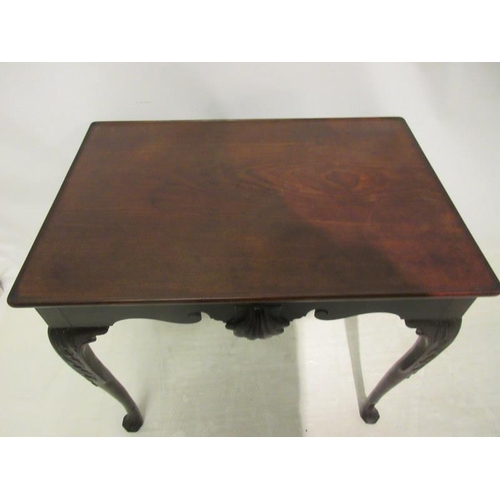 145 - A fine 18th century Irish walnut two sided silver or tea table, the rectangular top over shaped apro... 