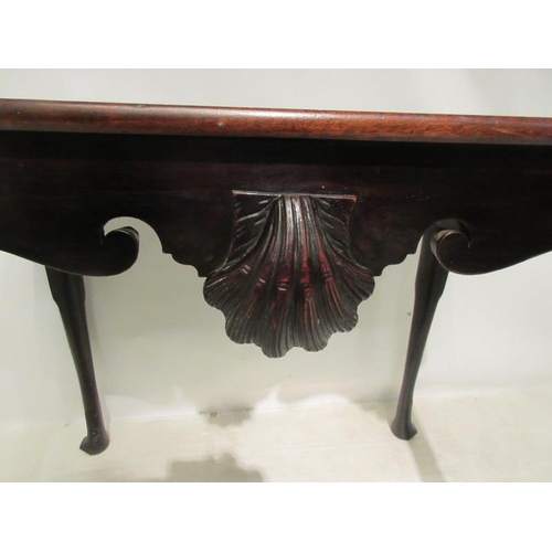 145 - A fine 18th century Irish walnut two sided silver or tea table, the rectangular top over shaped apro... 