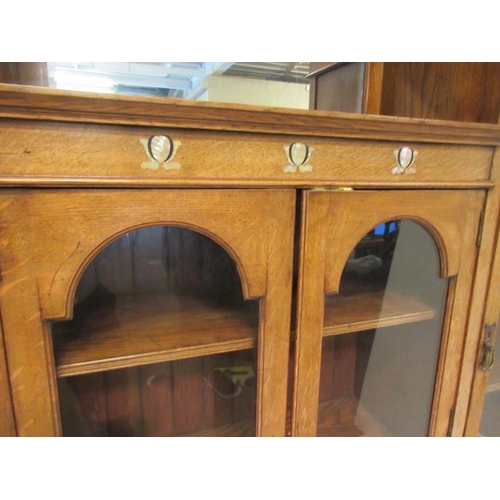 150 - A late 19th century Arts & crafts oak side cabinet having mother of pearl inlay, the side doors with... 