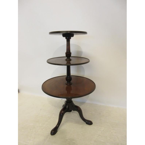 154 - Georgian mahogany three tier dumbwaiter having circular trays on tripod support. H. 96cm approx.