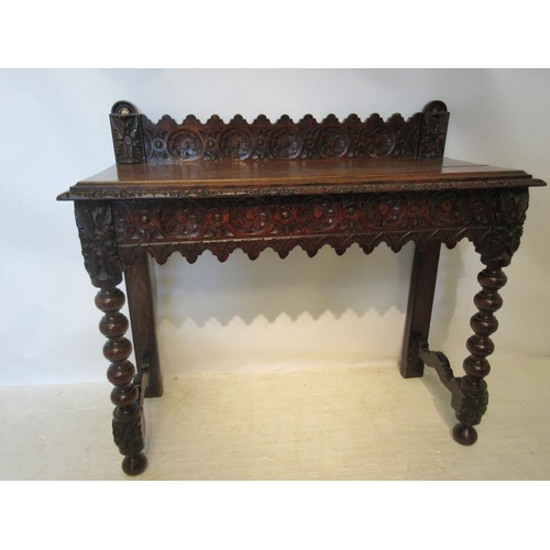 159 - 19th century carved oak side table raised on bobbin legs. W. 104cm, H. 93cm, D. 42cm approx.