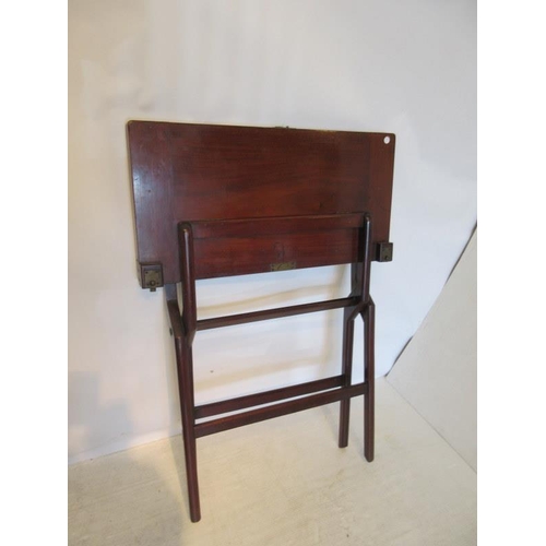 16 - A folding mahogany card table with brass fittings. 
76cm x 76cm approx.