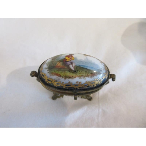 162 - A Birmingham silver circular box with enamel top (some damage), a porcelain & gilded oval shaped cas... 