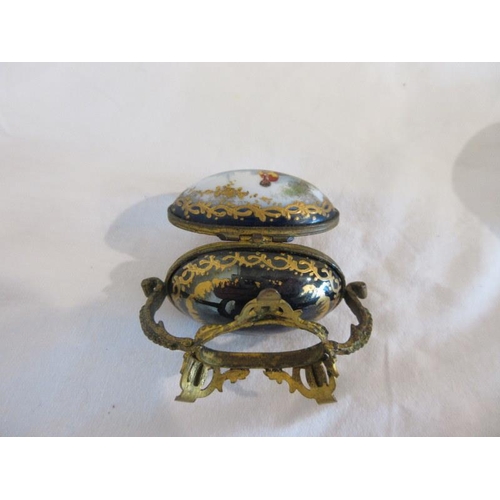 162 - A Birmingham silver circular box with enamel top (some damage), a porcelain & gilded oval shaped cas... 