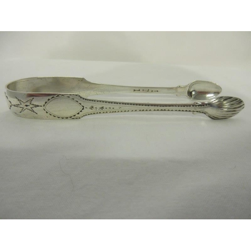 167 - Georgian bright cut silver sugar tongs.