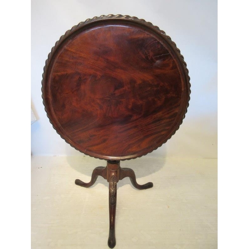 220 - A good antique mahogany wine table, the circular top with rope edge decoration raised on carved cent... 