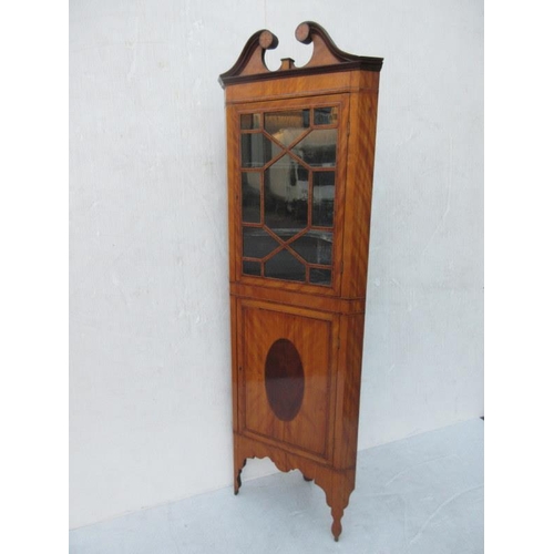 225 - A very neat size antique satinwood corner cabinet,the upper part with section glass door, the base w... 