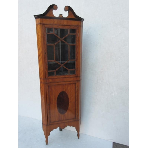 225 - A very neat size antique satinwood corner cabinet,the upper part with section glass door, the base w... 