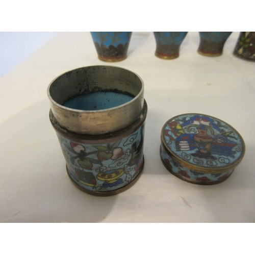 243 - Eleven pieces of Cloisionne - napkin rings, small vases, jars with lids. (11)