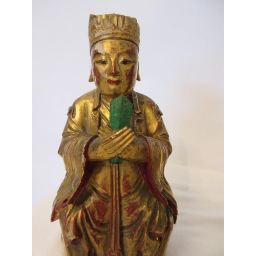 244 - A group of Chinese carved gilt wood statues. (3)