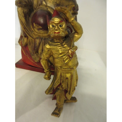 244 - A group of Chinese carved gilt wood statues. (3)