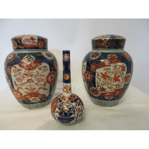 245 - A pair of 19th century Imari urns and lids and a single Imari vase. Height of urns 9cm.