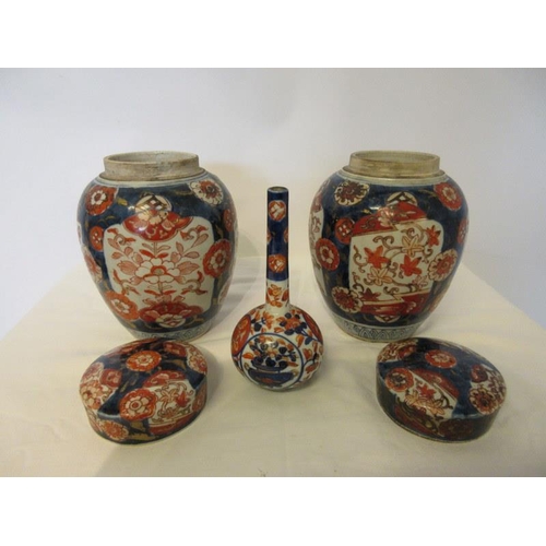 245 - A pair of 19th century Imari urns and lids and a single Imari vase. Height of urns 9cm.