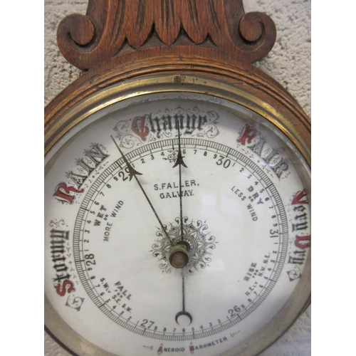 32 - Antique oak cased aneroid barometer and therometer, S. Faller, Galway. AF