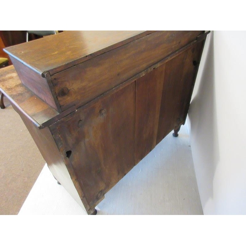 42 - A mid 19th century mahogany chest of four short & three long drawers having tulip capped side column... 