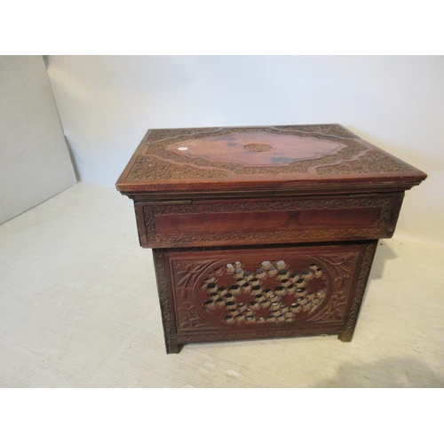 50 - A decorative carved wood lift top occasional table. (possibly Indian) W. 51, D. 39cm, H. 43cm approx... 