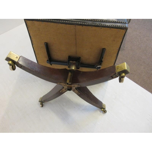 57 - Antique mahogany & leather office swivel chair raised on splay feet with brass tow castors. (needs r... 