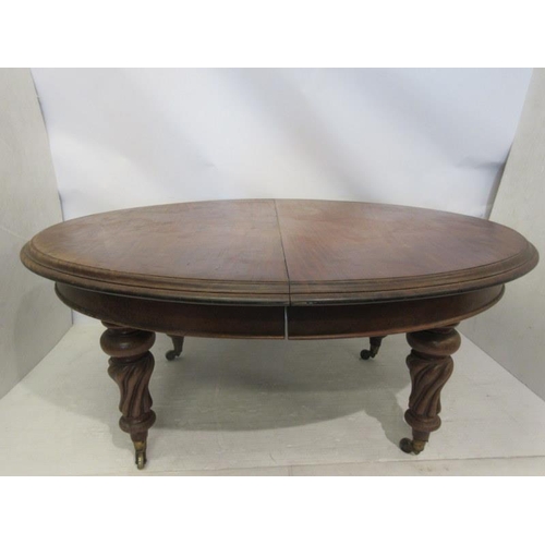 59 - A good early 19th century mahogany dining table, the oval shaped top supported on four nicely turned... 