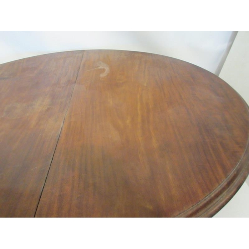 59 - A good early 19th century mahogany dining table, the oval shaped top supported on four nicely turned... 