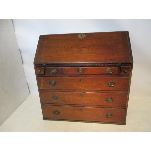 83 - An 18th century Virginia walnut writing bureau, the slope front revealing a fitted interior over one... 