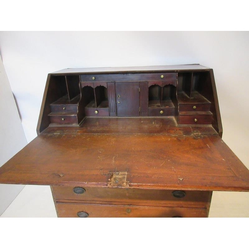 83 - An 18th century Virginia walnut writing bureau, the slope front revealing a fitted interior over one... 