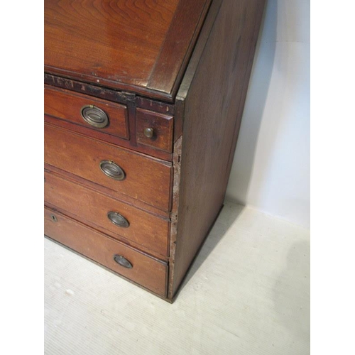 83 - An 18th century Virginia walnut writing bureau, the slope front revealing a fitted interior over one... 