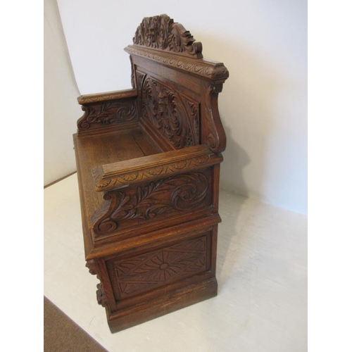 84 - Good antique carved oak monks bench with lift up seat. W. 120cm, D. 48cm, H. 100cm approx.