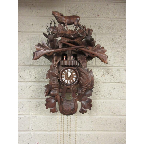 89 - A German carved wood cuckoo clock.