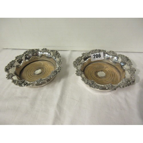 206 - A good pair of antique silver plated wine coasters.