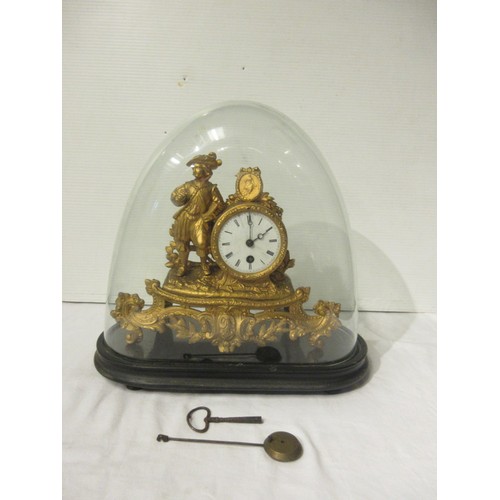 215 - A 19th century gilt metal mantel clock under glass dome.