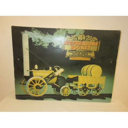 213 - A good Stephensons Rocket with its original box by Hornby, this is a working model which runs on ste... 