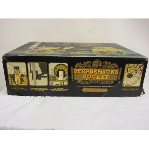 213 - A good Stephensons Rocket with its original box by Hornby, this is a working model which runs on ste... 