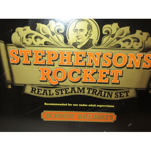 213 - A good Stephensons Rocket with its original box by Hornby, this is a working model which runs on ste... 