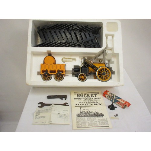 213 - A good Stephensons Rocket with its original box by Hornby, this is a working model which runs on ste... 