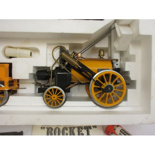 213 - A good Stephensons Rocket with its original box by Hornby, this is a working model which runs on ste... 