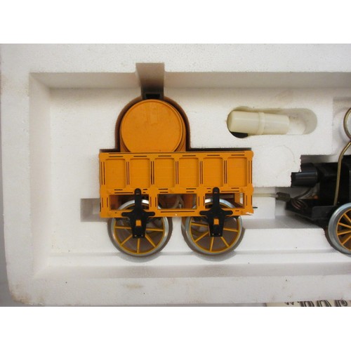 213 - A good Stephensons Rocket with its original box by Hornby, this is a working model which runs on ste... 