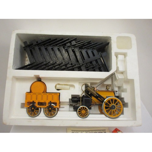 213 - A good Stephensons Rocket with its original box by Hornby, this is a working model which runs on ste... 