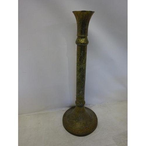 33 - A tall Eastern brass stand. H. 140 cm approx.