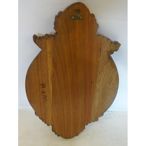 35 - Decorative timber wall plaque with carved head and shell decoration.  Length 80cm approx.