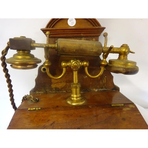 39 - Interesting old wall mounted telephone, very complete.