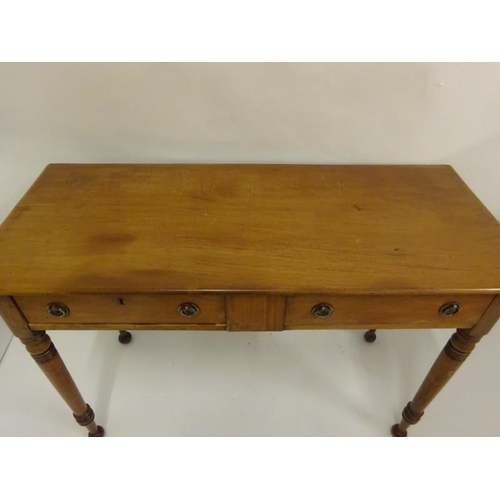 42 - Antique mahogany side table fitted with two drawers and raised on ring turned legs. W. 116cm D. 49cm... 