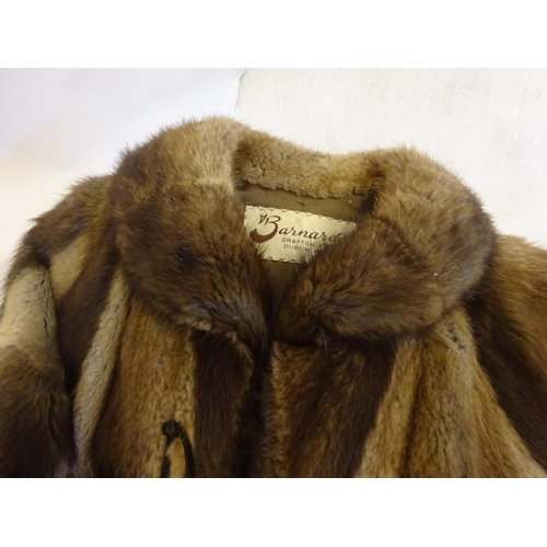 54 - Ladies fur coat from Barnardo's Graffton St., Dublin. Some damage (see photos) Length 120cm approx.