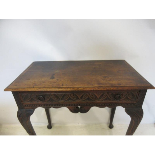 57 - Neat sized antique oak table having carved freize and sides and raised on four pad feet. W. 73cm, D.... 