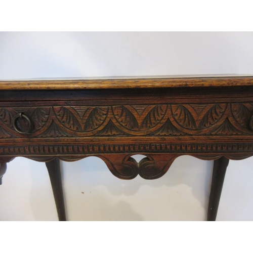 57 - Neat sized antique oak table having carved freize and sides and raised on four pad feet. W. 73cm, D.... 